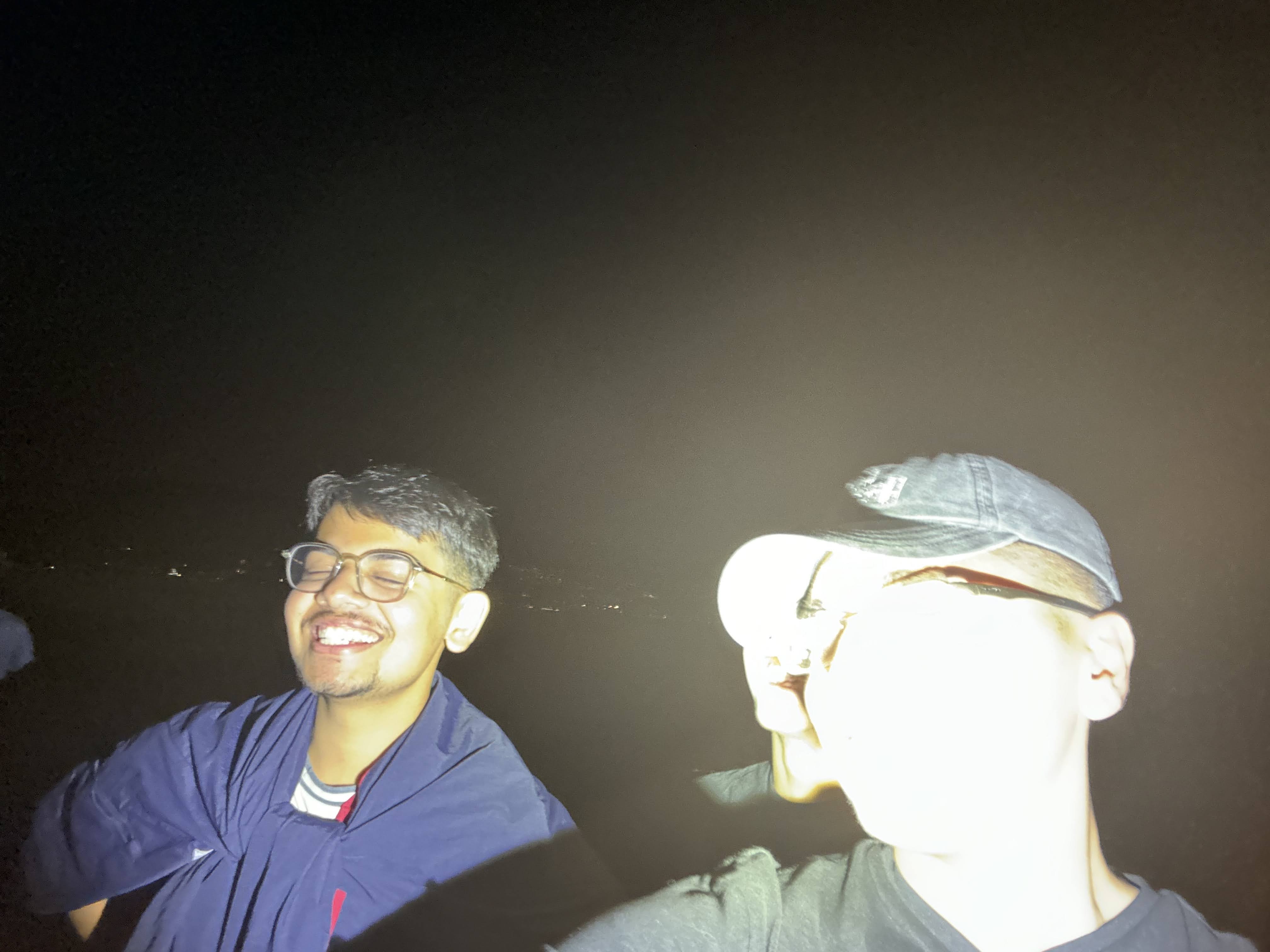 A selfie with Advay , another attendee, illuminated with a blindingly bright flashlight